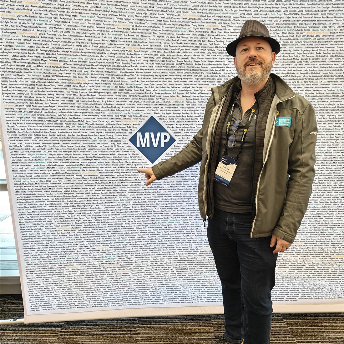Martin Hinshelwood at the Microsoft MVP Global Summit, pointing to his name on the MVP wall